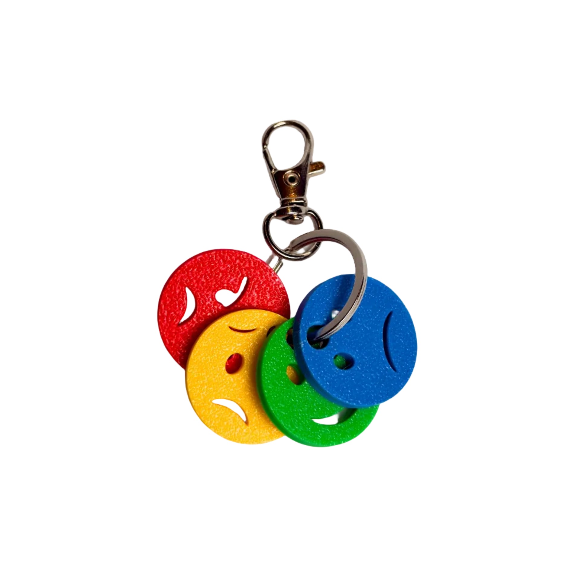 Infographic for the 'MINI EMOTIONS KEYCHAIN' titled 'PORTABLE EMOTIONAL AWARENESS'. It shows the keychain with blue, green, yellow, and red faces. Text boxes explain the emotions: Blue (Sad, Tired, Bored), Green (Calm, Happy, Focused), Yellow (Worried, Silly, Exhausted), and Red (Mad, Angry, Out of Control). The bottom highlights it's 'PERFECT FOR ON-THE-GO LEARNING!'.